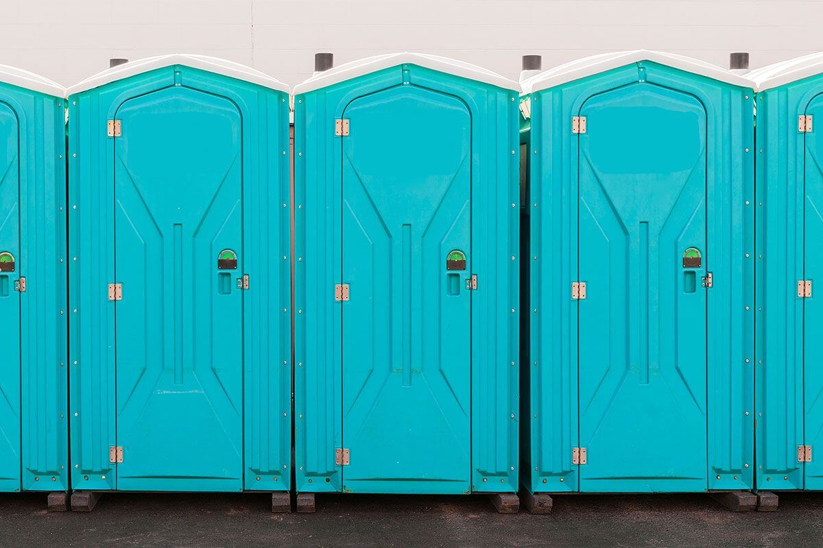 Industrial portable restroom units at a plant in Porterville, California